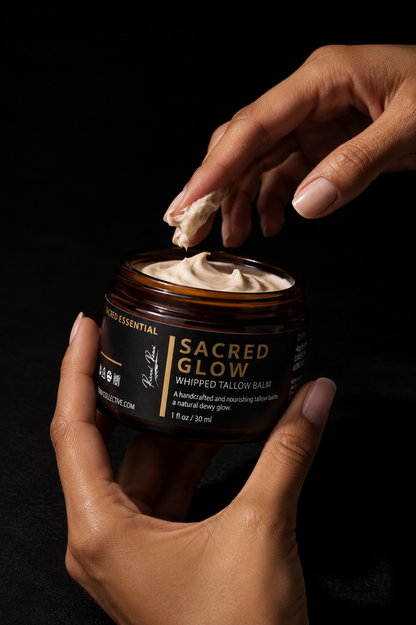 Person applying 'Sacred Glow' whipped tallow balm from a jar on a black background